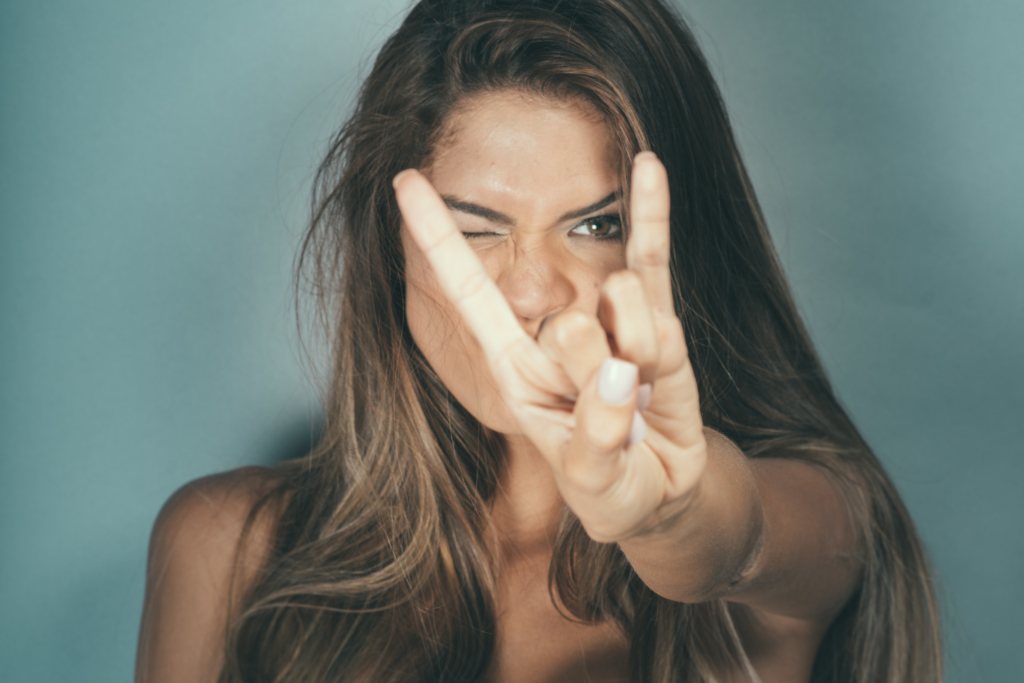 Girl Doing The Devils Horns Rock And Roll Symbol 1024x683